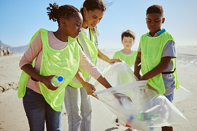 Buy stock photo Diversity, beach cleaning and plastic recycling for teamwork, pollution ecology and environmental change collaboration. Eco friendly team, interracial people and ocean garbage recycle together 