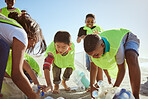 Beach, recycle and group of children cleaning the environment for volunteer, charity or ngo support, help and teamwork. Diversity friends or students recycling plastic for pollution or earth day
