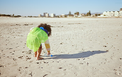 Buy stock photo Plastic bottle, beach and child recycling for ocean, earth day or climate change education, learning and volunteer support in nonprofit. Girl recycle, environment and bottle on ground for pollution