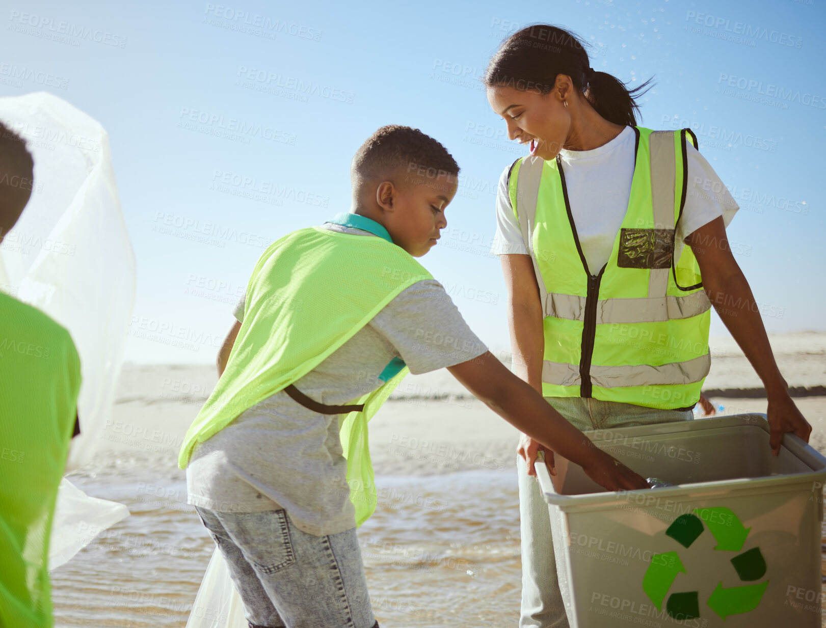 Buy stock photo Recycling, ocean and woman with children or group at cleaning for volunteering on earth day support, help and community. Family and mother with recycle box for pollution, climate change and ecology