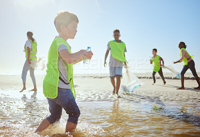 Buy stock photo Plastic recycling, children and beach cleaning for eco friendly sustainability, teamwork and global conservation. Waste recycle project, youth team action and fun in ocean for sea pollution clean up