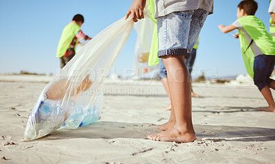 Buy stock photo Children, legs or plastic bottles in beach clean up, climate change collection or environment sustainability recycling. Kids, diversity or students in cleaning waste management or community service