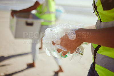 Buy stock photo Cleaning, plastic and hands of volunteer at beach for recycle, environment or earth day. Recycling, sustainability and  climate change with charity team and trash for pollution, eco friendly and help