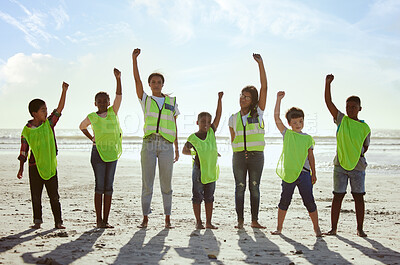 Buy stock photo Children, volunteer and beach clean up with friends standing on the sand together for eco friendly conservation. Team, nature and cleaning with kids cleaning the environment for a green earth