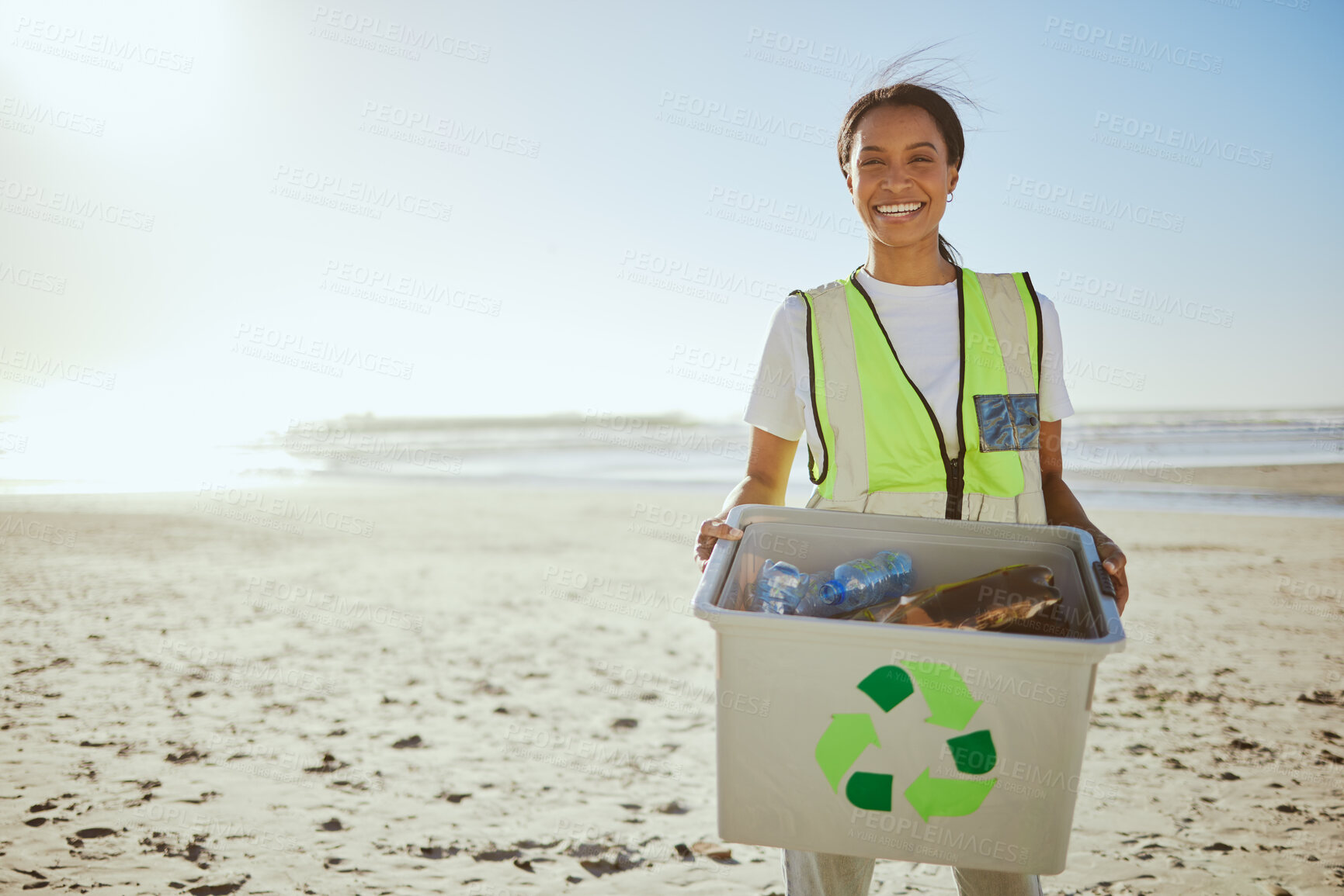 Buy stock photo Recycle, plastic and woman cleaning beach for sustainability, green environment and eco friendly world with happy volunteering portrait. Box, bottle and black woman at sea for pollution or earth day