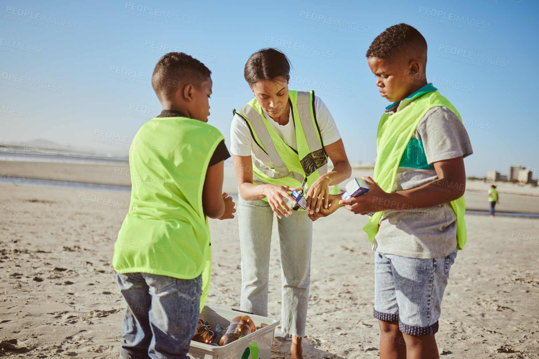 Buy stock photo Plastic, beach volunteering and woman with children recycling, cleaning and learning, education or community for pollution. Family, mother and kids recycle with teamwork, project goals and earth day