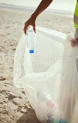 Buy stock photo Cleaning, plastic and hands of volunteer at beach for recycle, environment or earth day. Recycling, sustainability and climate change with charity activist and trash bag for pollution or eco friendly