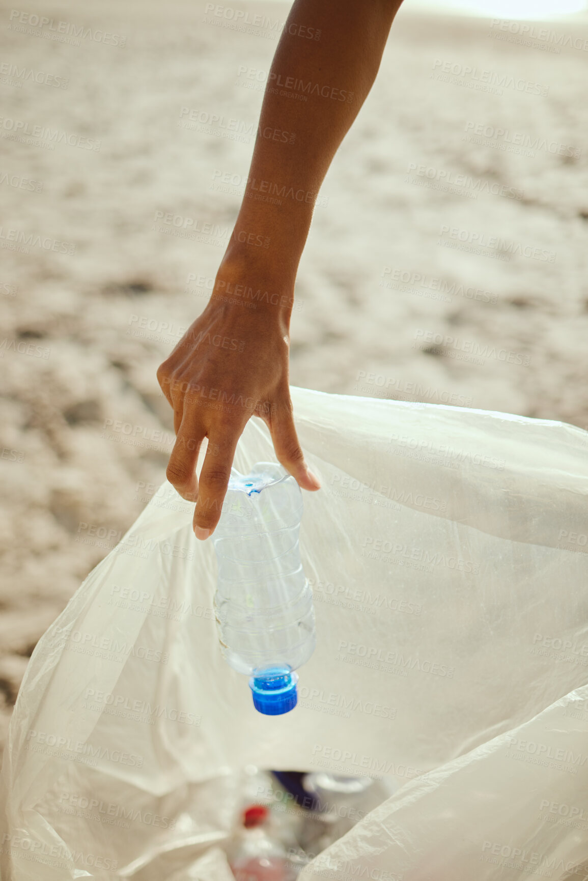 Buy stock photo Cleaning, plastic and hands of volunteer at beach for recycle, environment or earth day. Recycling, sustainability and climate change with charity person and trash bag for pollution and eco friendly