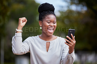 Buy stock photo Happy black woman, phone and winner for good news, promotion or business opportunity in the outdoors. African American woman with smile in excitement for bonus, achievement or victory on smartphone