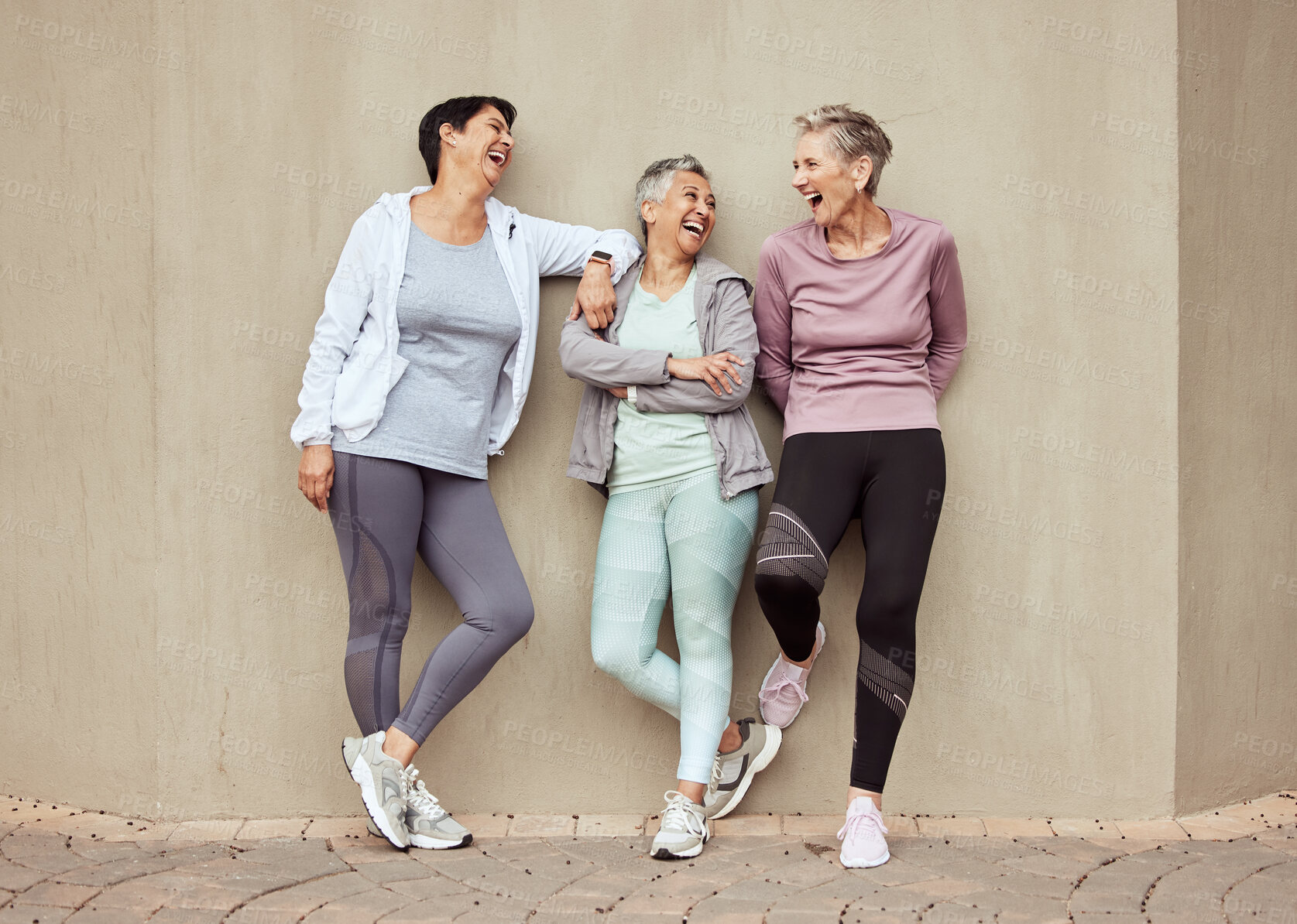 Buy stock photo Senior women, exercise and funny with retirement, fitness and wellness, vitality and active lifestyle against wall background. Mature female friends, comedy and training, relax and sports motivation 