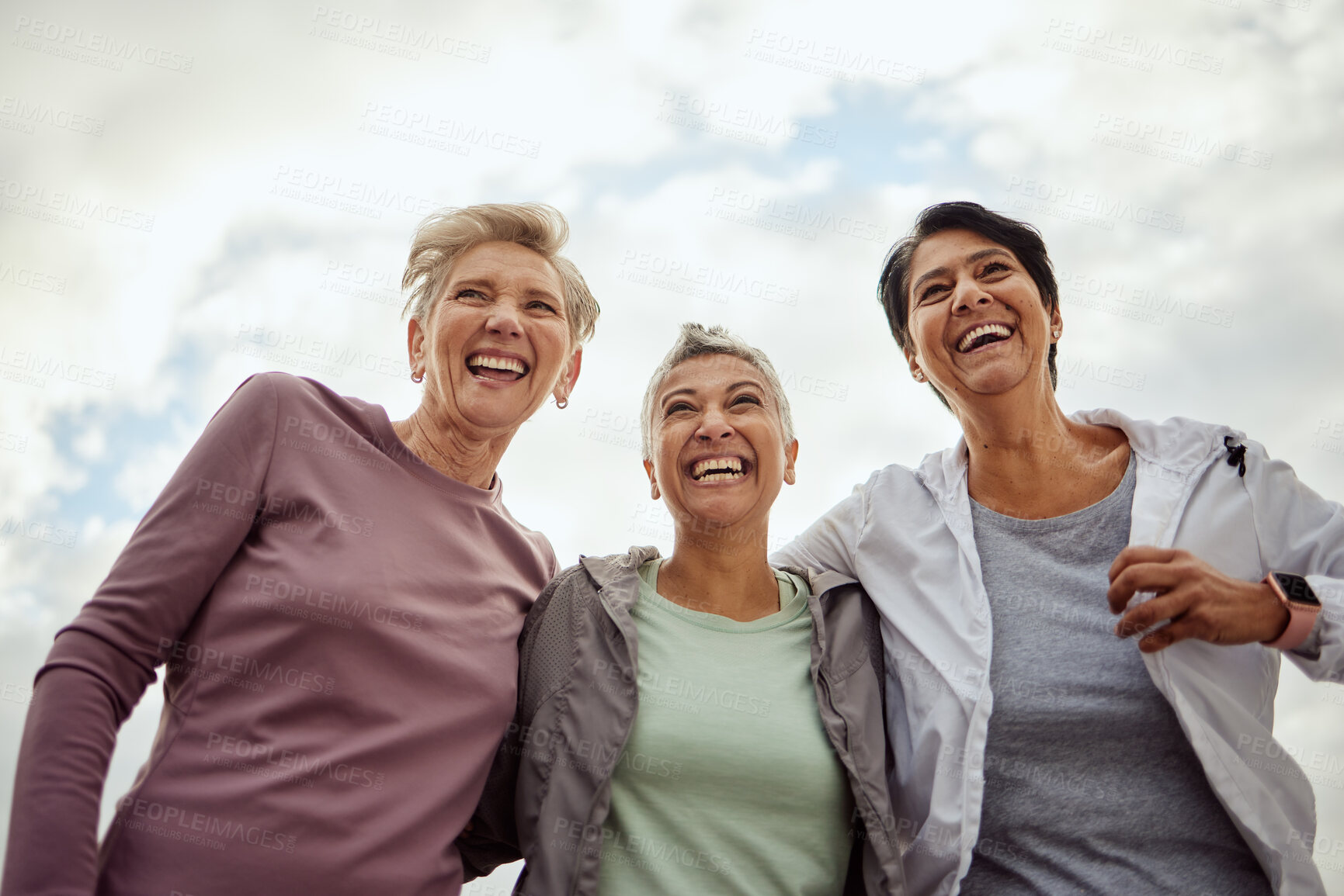 Buy stock photo Diversity, happy women and laughing for sports, fitness and support on mockup sky background. Low angle, senior female group and exercise friends excited for community wellness, freedom or motivation