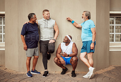 Buy stock photo Happy men, fitness break and group exercise on wall background in urban city. Smile, sports training and male friends talking about workout, wellness support and team diversity of healthy lifestyle
