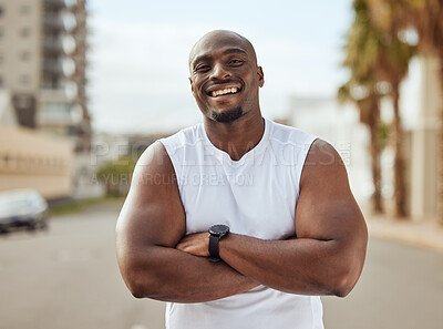 Buy stock photo Black man, fitness and smile with arms crossed in the city for running exercise, workout or training in the outdoors. Portrait of a African American, confident and sporty male smiling in a urban town