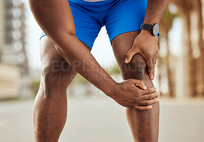 Buy stock photo Fitness, pain in knee and hands of black man with muscle ache, joint pain and injury after running in city. Sports, body wellness and male athlete rest after workout, marathon training and exercise