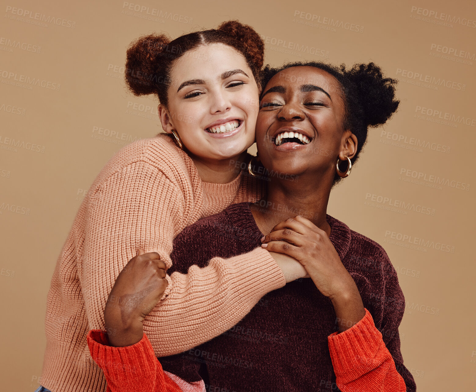 Buy stock photo Lesbian, couple hug with young women and happy with fashion and marketing, love and fun together against studio background. Lgbtq community, gen z and freedom with style and lgbt people with pride