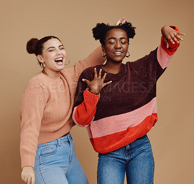 Buy stock photo Fashion, friends and dance with teen girl, young and trendy with gen z style, fun and freedom against studio background. Laugh, funny and dancing with stylish youth, happy with energy and marketing