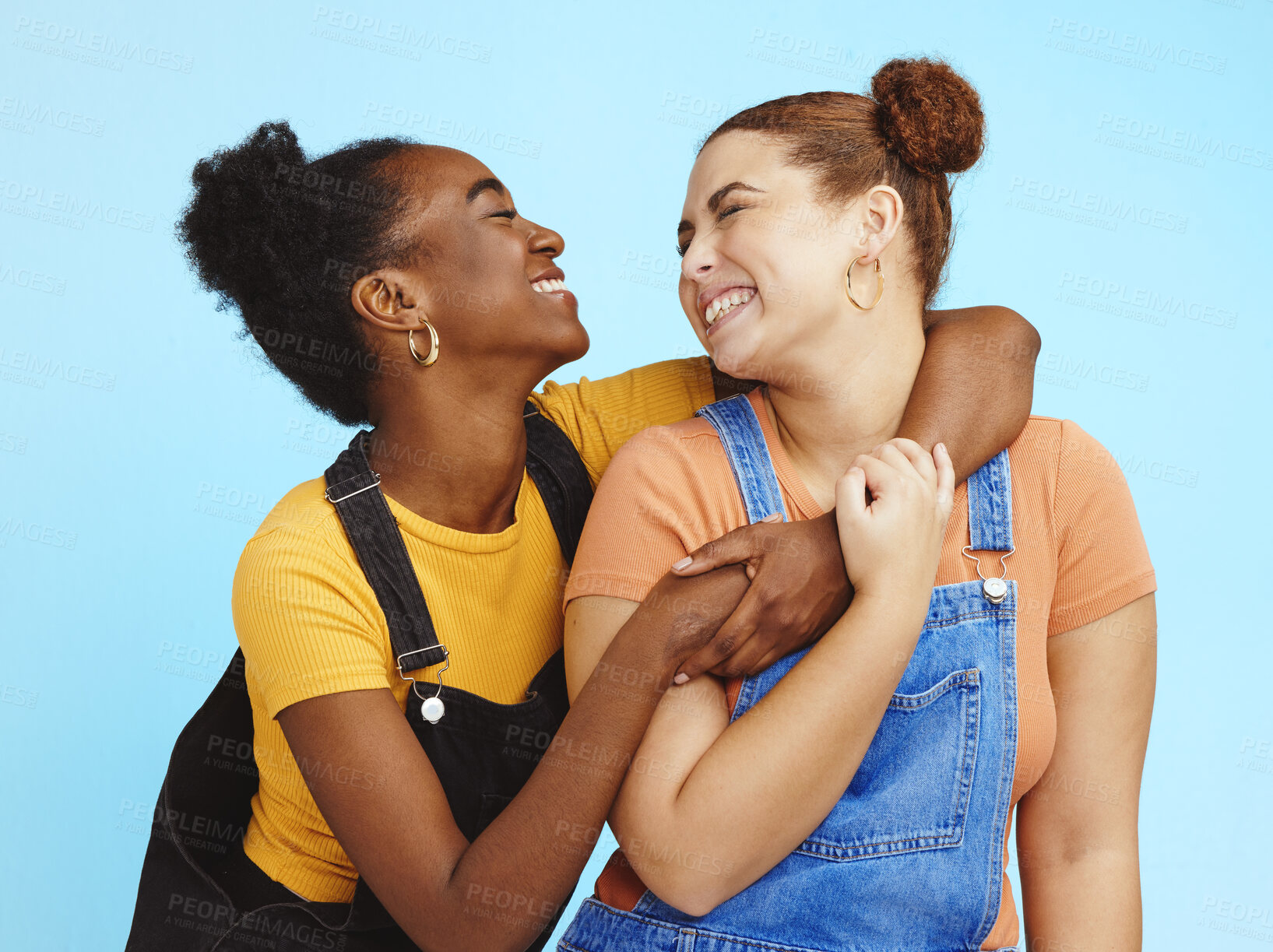 Buy stock photo Hug, lesbian women and couple with happiness, young and gen z with lgbt, fashion and marketing with love against studio background. Happy lgbtq community, fun and freedom with style and pride