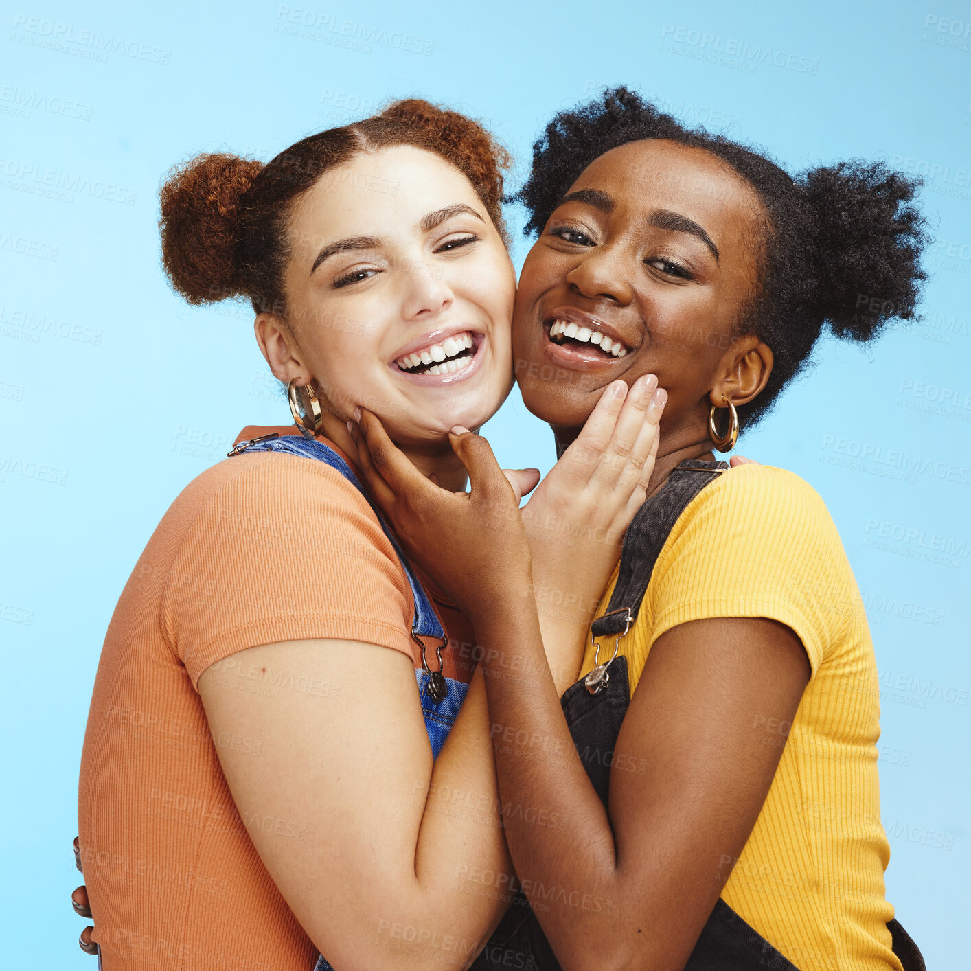 Buy stock photo Friends, hug and portrait smile for happy friendship, lesbian or relationship against a blue studio background. Face of interracial female couple smiling and touching in pride for LGBTQ and fashion