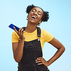 Phone, fashion and black woman laugh on blue background for social media, internet and chat mockup. Communication, advertising and happy girl on call, talking and laughing with smartphone in studio