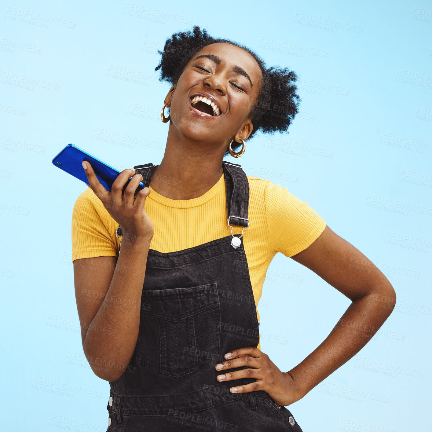 Buy stock photo Phone, fashion and black woman laugh on blue background for social media, internet and chat mockup. Communication, advertising and happy girl on call, talking and laughing with smartphone in studio