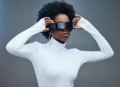 Buy stock photo Fashion, hands and black woman with futuristic sunglasses, gen z and stylish with trendy designer brand against studio background. Young, cyberpunk and natural curly hair with beauty and edgy style