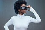 Futuristic sunglasses, fashion and black woman, young gen z and stylish with trendy designer brand against studio background. Model, cyberpunk and natural curly hair with beauty and edgy style