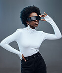 Futuristic sunglasses, fashion and black woman, cyberpunk and gen z with trendy designer brand against studio background. Young model, stylish and natural curly hair with beauty and edgy style