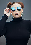 Fashion, beauty and face of woman with sunglasses in studio for cosmetics, makeup and luxury style. Fashion model, designer brand and confident girl with accessories, trendy clothes and jewellery