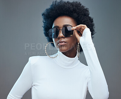 Buy stock photo Sunglasses, fashion and young black woman with gen z style and designer with trendy brand against studio background. Afro hair, edgy and girl, marketing with fashion model and stylish beauty