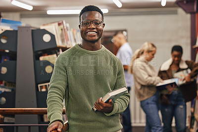 Buy stock photo Black man, book and portrait in library with smile, research and studying at college for education. African gen z student, happy and university for books, learning or vision for future career goal