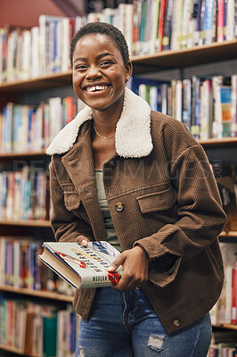 Buy stock photo Black woman student, portrait and book in library, research or medical education with smile. African gen z woman, books and shelf at university for goals, learning and motivation for future vision