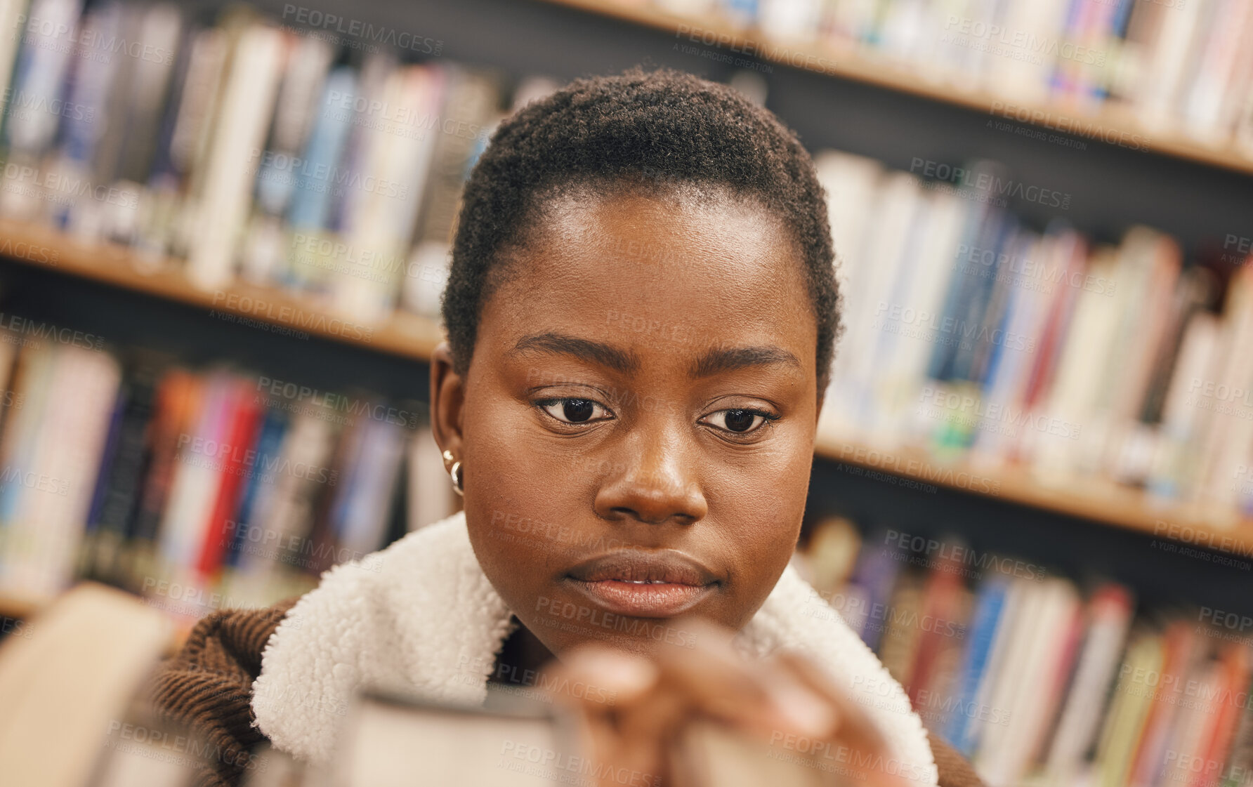 Buy stock photo Education, book search or black woman in library at college, university or school bookshelf for learning or studying. Research, scholarship or girl student focused on knowledge, goals or development