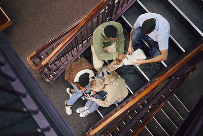 Buy stock photo Above, student group and stairs for study together, thinking and research for exam, test or education. Students, diversity and teamwork for support, ideas and collaboration at university for mission