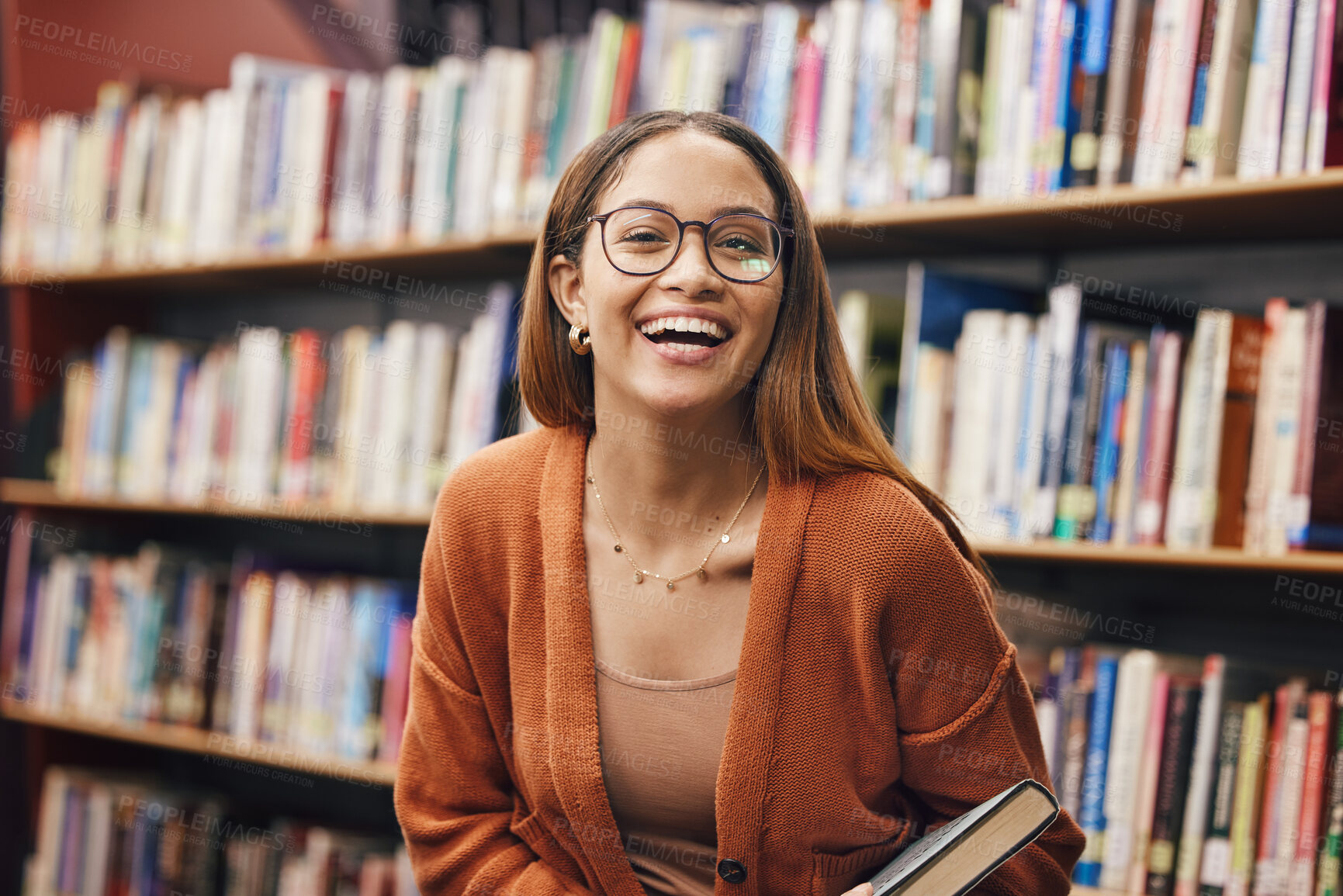 Buy stock photo Face, student and woman in library with book ready for learning. Portrait, university education and happy female from Brazil standing by bookshelf for studying, knowledge and literature research.