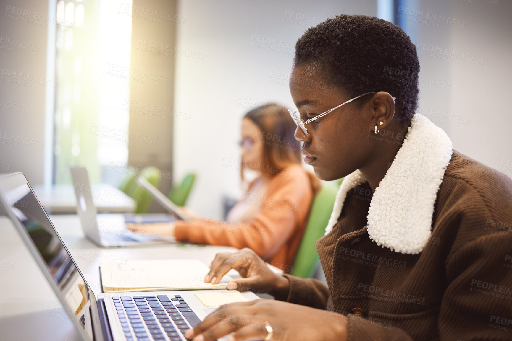 Buy stock photo Education, black woman and laptop for studying, knowledge and learning in classroom. African American female, student and academic with online research, study notes or prepare for exam, test or focus