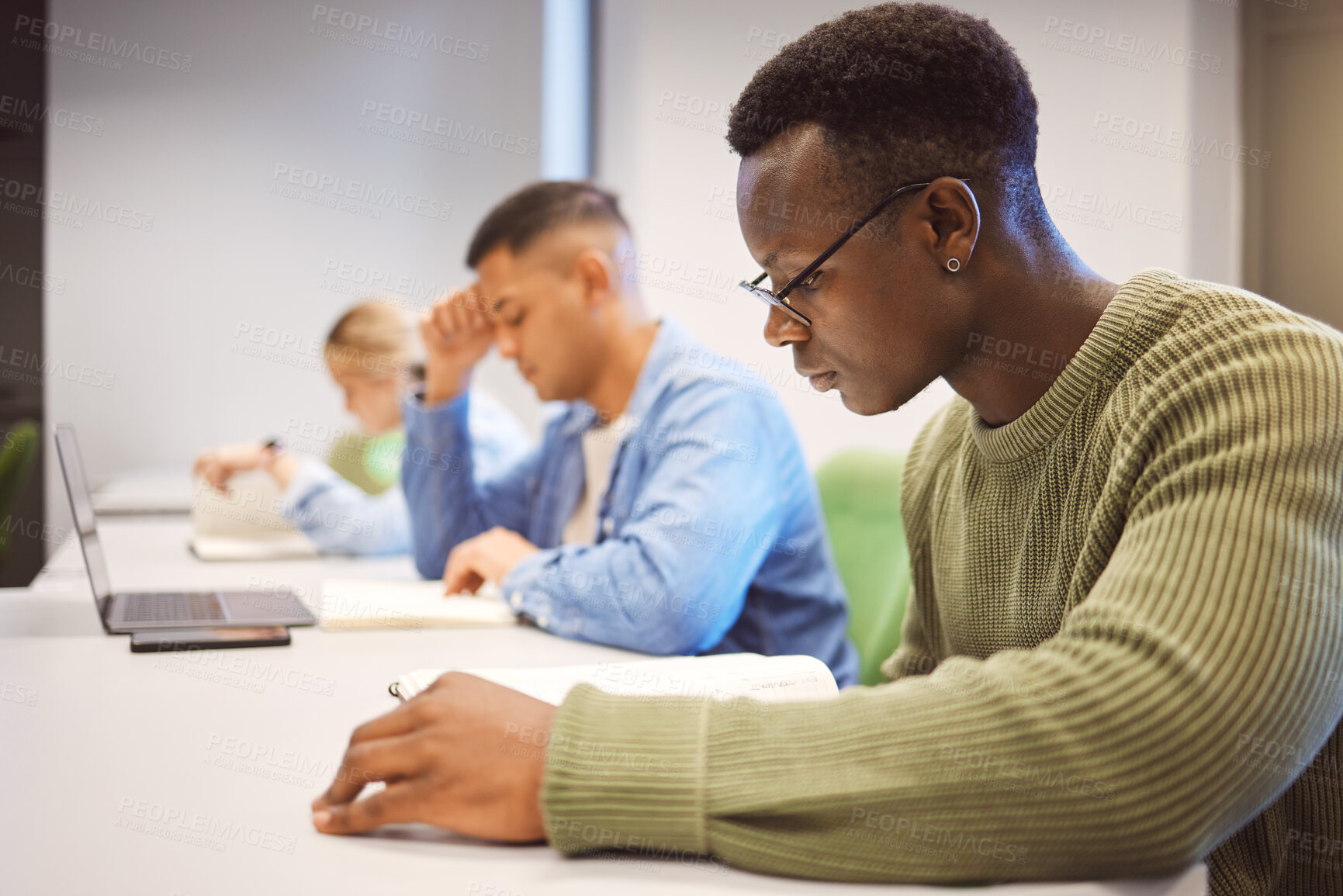 Buy stock photo Black man, students and studying for education, knowledge and focus for exams, campus and intelligent. African American male, student and young people on university, concentration and research notes