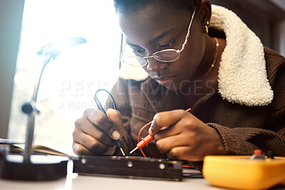 Buy stock photo University student, engineering and electronics with black woman learning on electrical project. Education, engineer or technician with technology voltage test for electricity and innovation in class