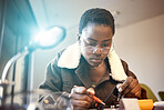 Black woman, student and engineer with electrical project while learning and studying. Education, engineering or technician at college with technology voltage meter for electricity and innovation