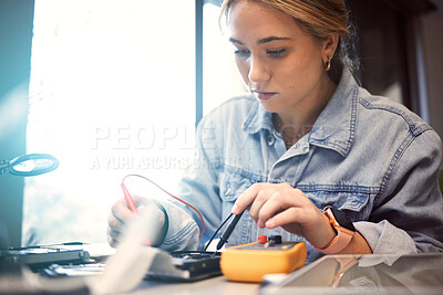 Buy stock photo Engineer, student and woman repair electronics for science project. Learning, education and female technician with technology testing microchip, gadget or circuits for electricity with electric meter