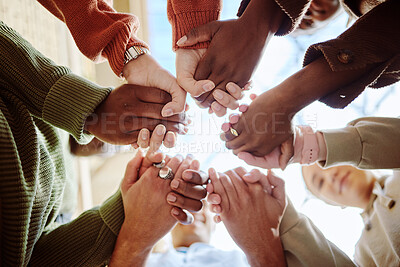 Buy stock photo Below, students and holding hands for support, motivation or education in campus community. Diversity, friends and motivation for learning with teamwork, studying or scholarship at college together