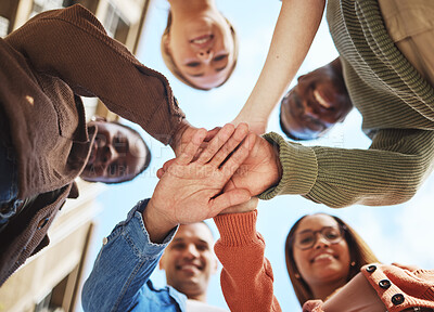 Buy stock photo Friends smile, hands together in huddle and group diversity, team building in circle from below. Friendship, happiness and support, university students smiling, happy men and women on college campus.
