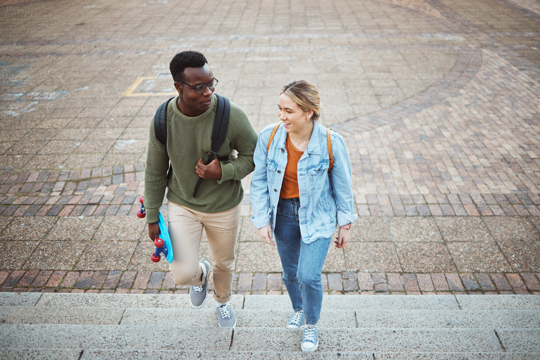 Buy stock photo University, students talking and friends, education and campus, study discussion with walk and talk together with learning. Scholarship, college and communication with black man and woman on steps