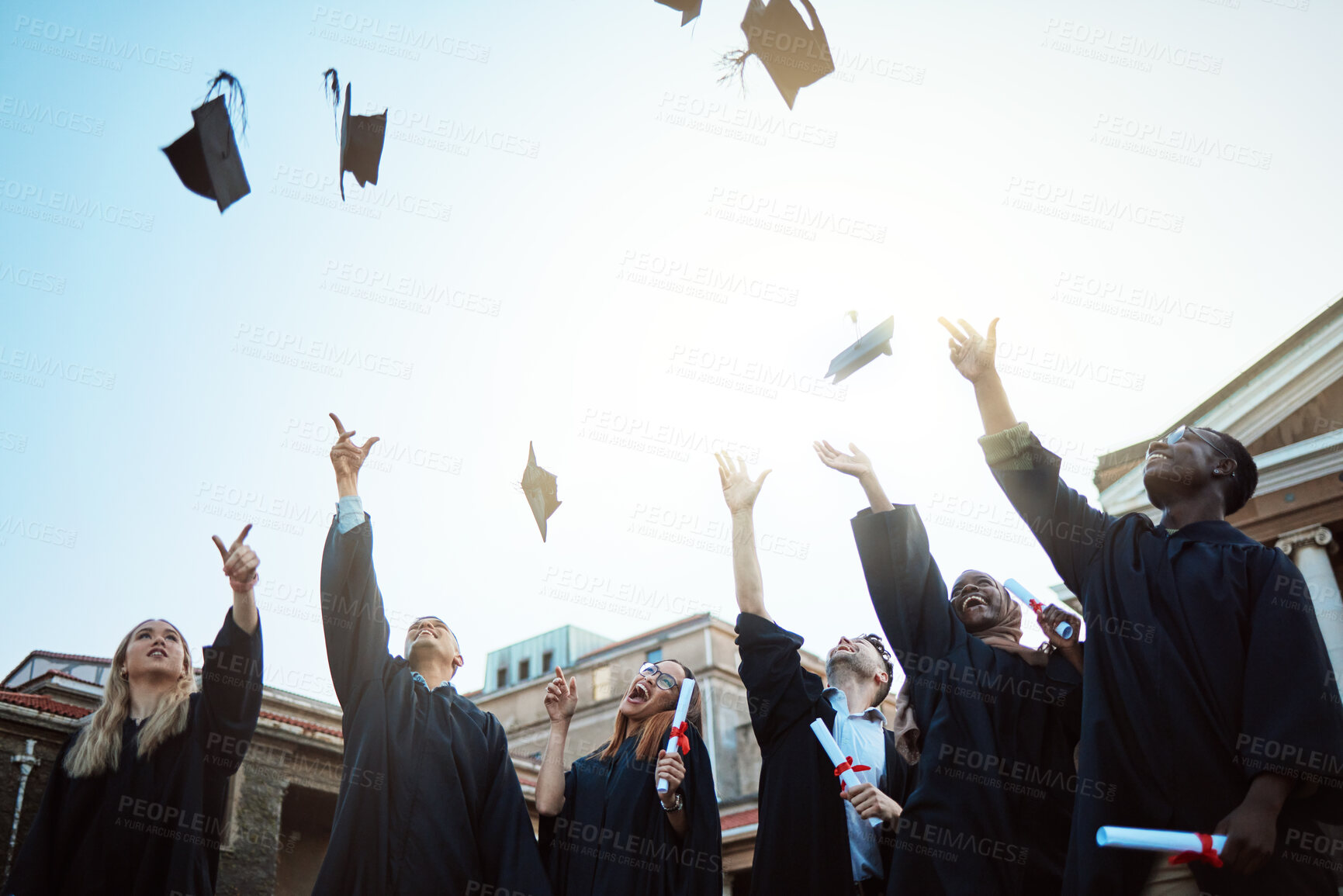 Buy stock photo Diversity, graduation hat or students with celebration, university or happiness outdoor. Young people, men or women with degree completion, education or knowledge for success, graduate or achievement