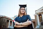 Graduation, education and portrait of woman at university, college and academic campus with diploma certificate. Celebration, graduate ceremony and girl student with success, victory and achievement