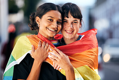 Buy stock photo Women, lgbtq and portrait with pride flag for love, equality and support in city. Gay, lesbian and couple of friends hug with rainbow identity, happy face and freedom at human rights parade event 