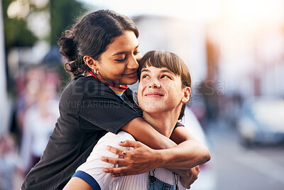 Buy stock photo Piggyback, love and lgbtq couple in the city, happy support and playful smile in Switzerland. Affection, hug and calm lesbian women smiling with pride in identity the urban street on the weekend