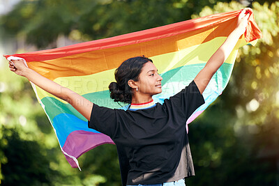 Buy stock photo Rainbow, flag and human rights with an indian woman in celebration of lgbt gay pride alone outdoor. Freedom, equality and lgbtq with a happy female outside celebrating her equality or inclusion