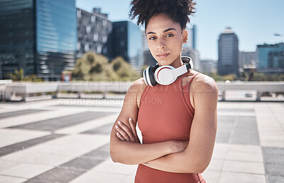 Buy stock photo Music, fitness and black woman in a city portrait for workout, exercise or training motivation, mental health and wellness Face of a sports athlete with headphones technology for audio subscription