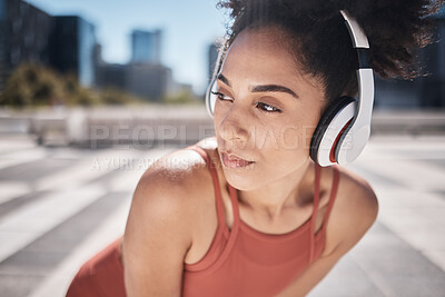 Buy stock photo Fitness, headphones and tired black woman runner stop to relax or breathe on city run or workout. Health, urban training and wellness, woman on break from running exercise while streaming music app.