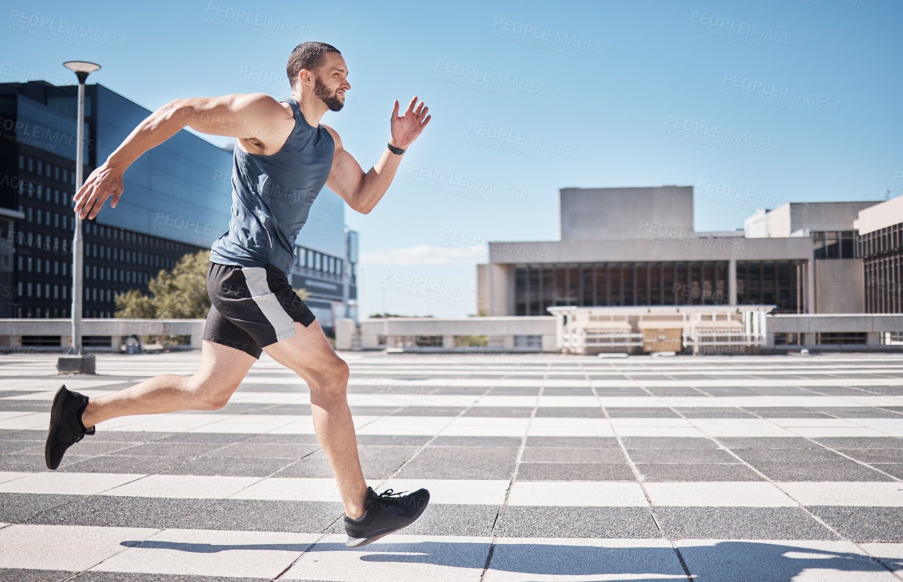 Buy stock photo Fitness, exercise and man running in city for health and wellness. Sports runner, energy and male athlete exercising, cardio jog or training workout outdoors on street for race, marathon or endurance